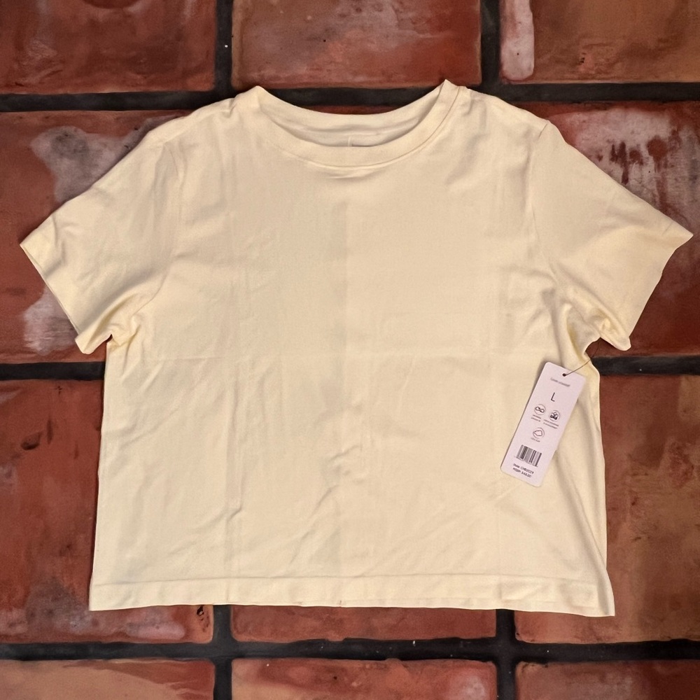 NWT! Really soft Harmony Balance light yellow cropped shirt. Size: large